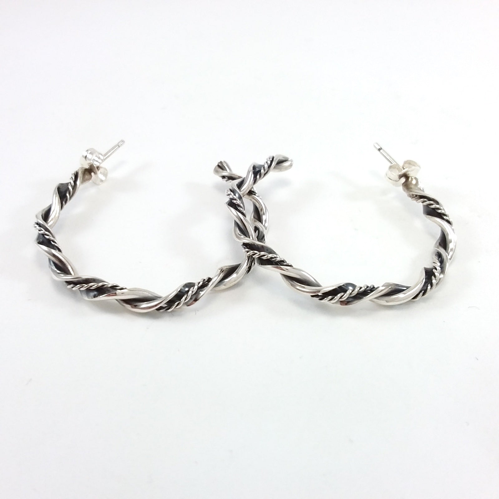 Navajo sterling silver twisted hoop earrings.