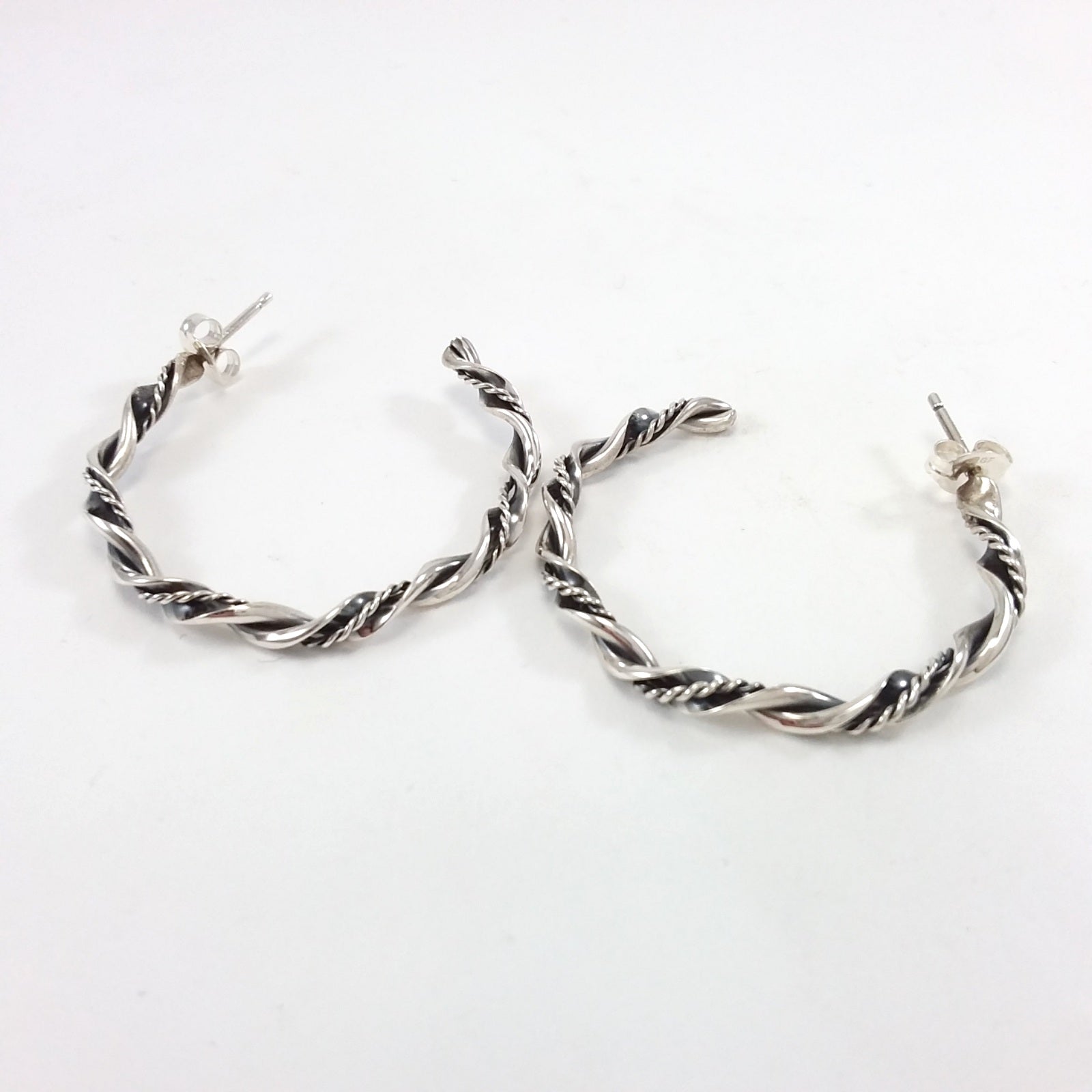 Navajo sterling silver twisted hoop earrings.