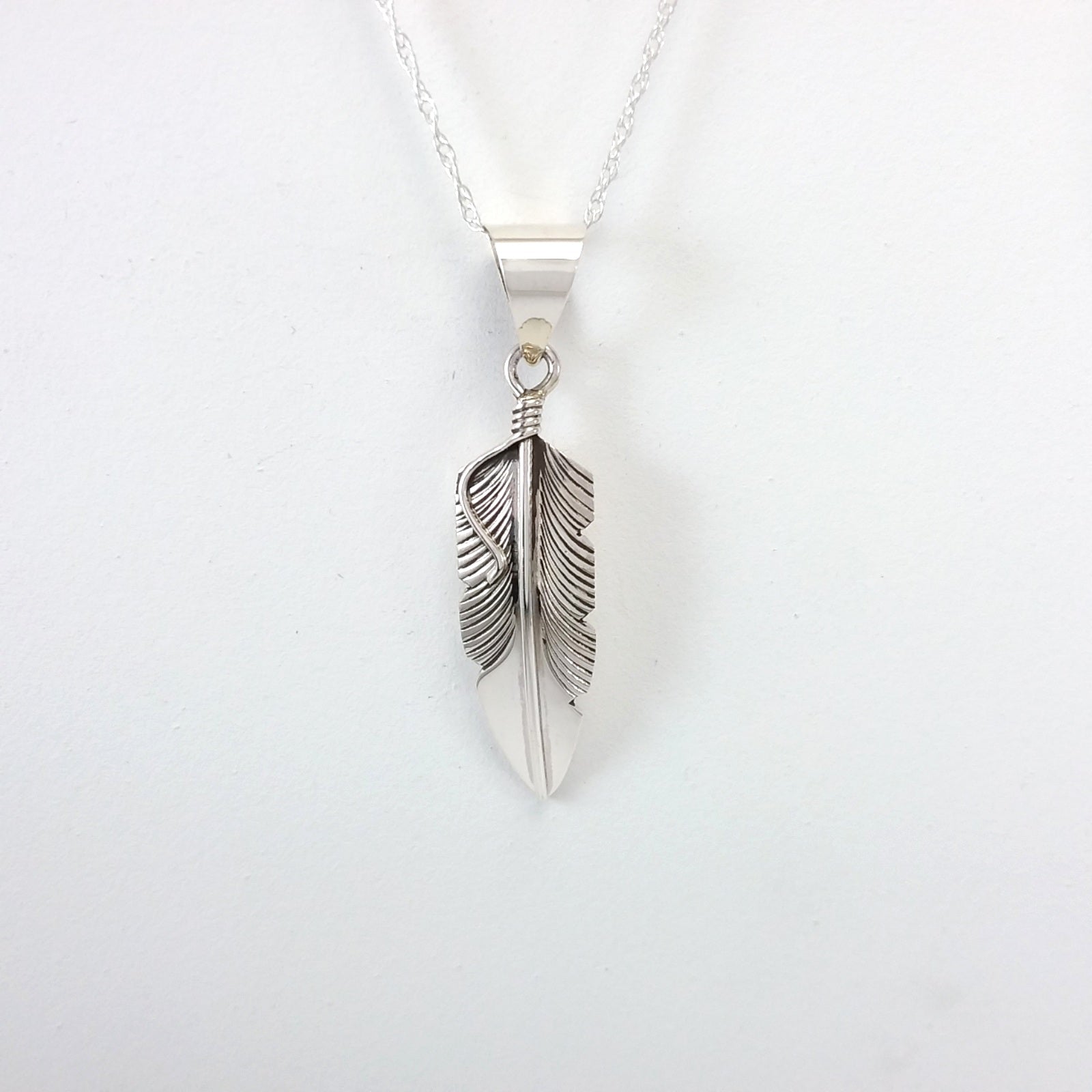 Navajo sterling silver feather pendant.