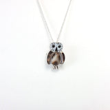 Zuni mother of pearl, jet, and shell sterling silver owl pin/pendant.